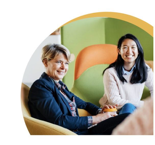 Two happy women engaged in a meeting