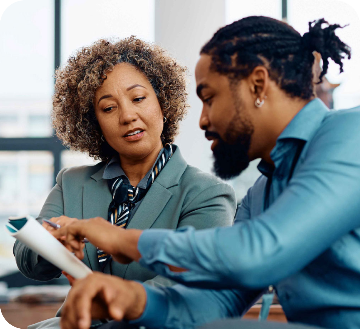 A man and a woman engaged in a work discussion