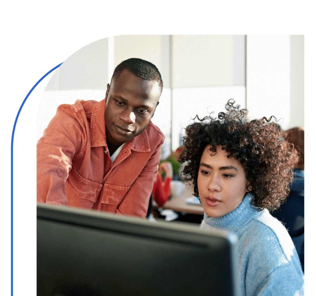 Two People Looking At Computer Screen