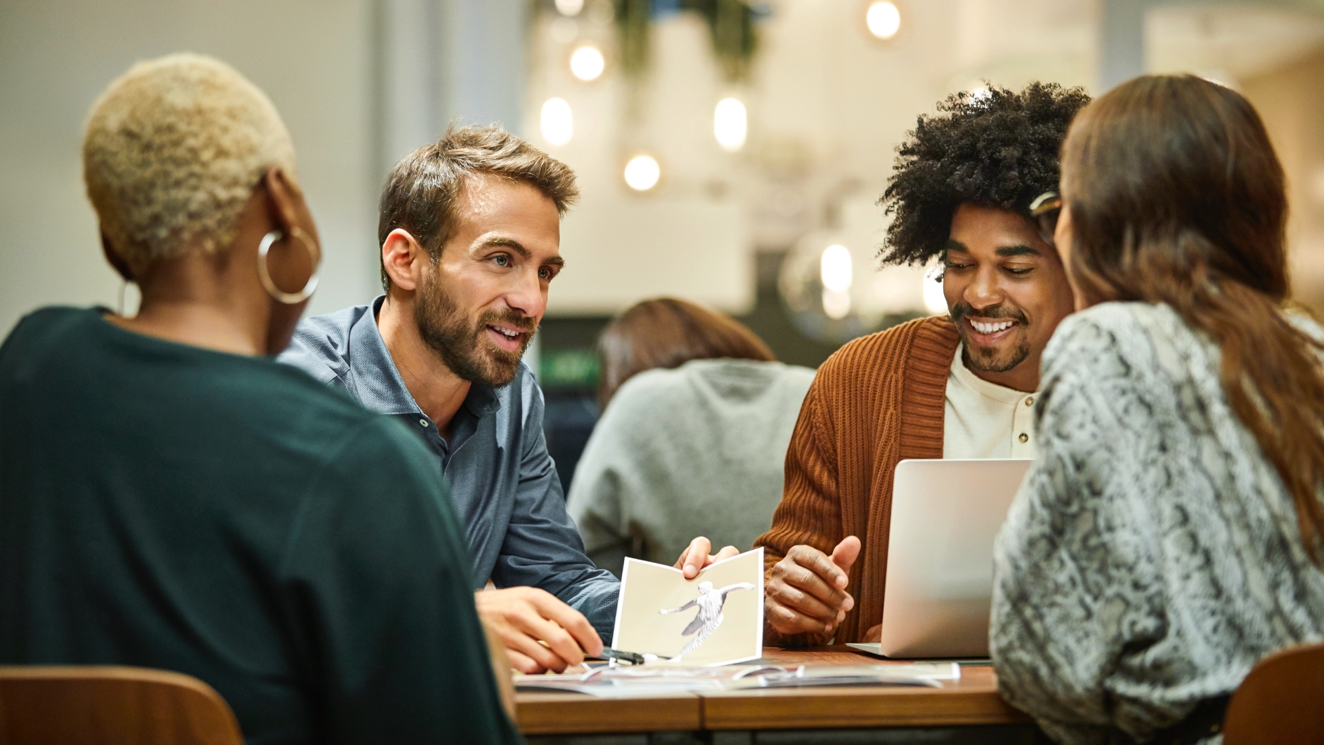 A group of young professionals in a business meeting