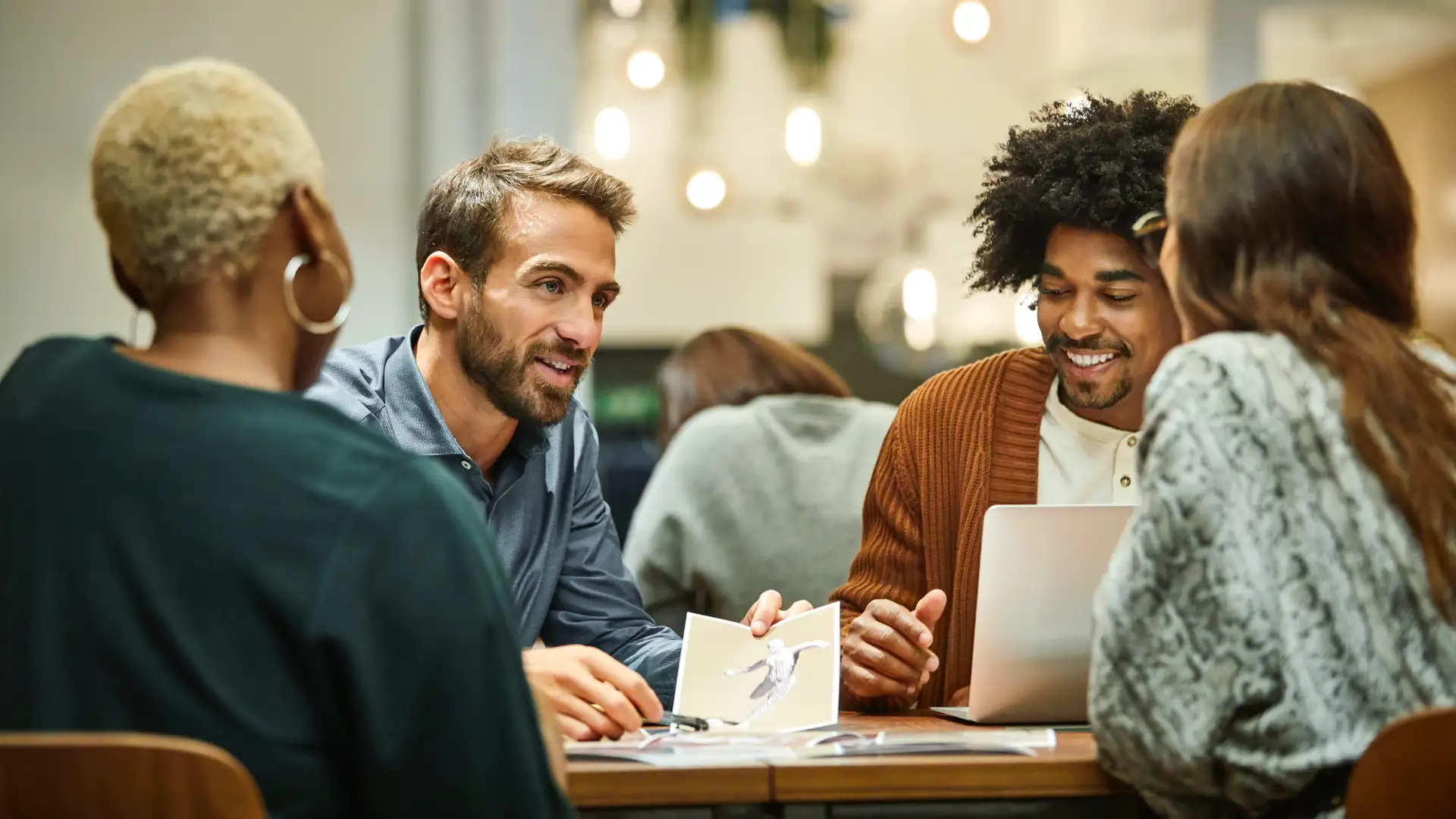 A group of young professionals in a business meeting