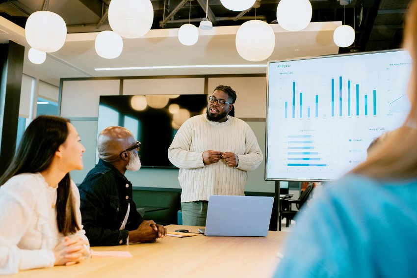 A group of people in a office meeting