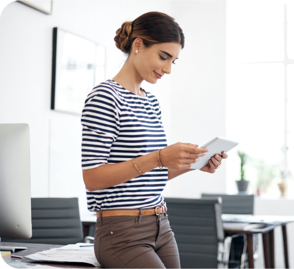 A young woman using tablet at work place