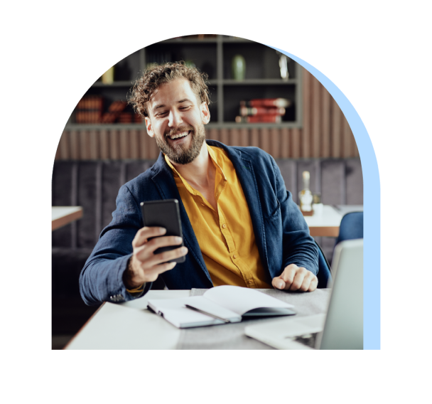 A happy man looking at phone screen